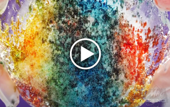 A multi colored ice tunnel thumbnail with a play button over the image