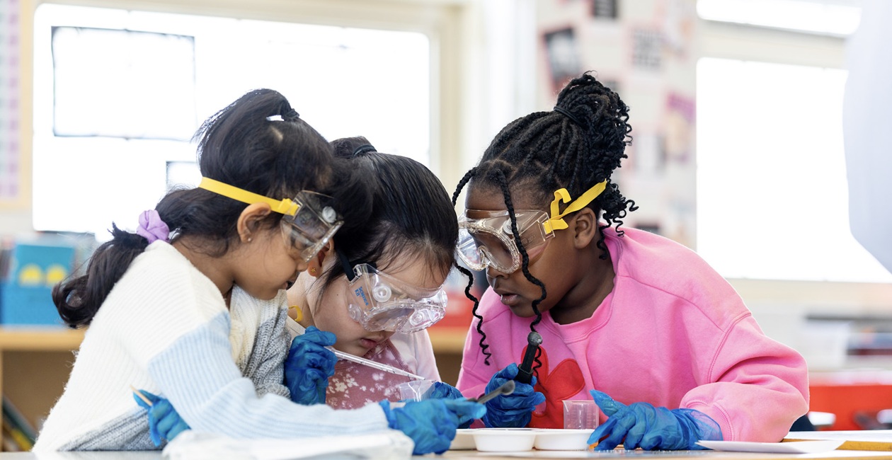 Mad Science after school program girls doing chemworks 
