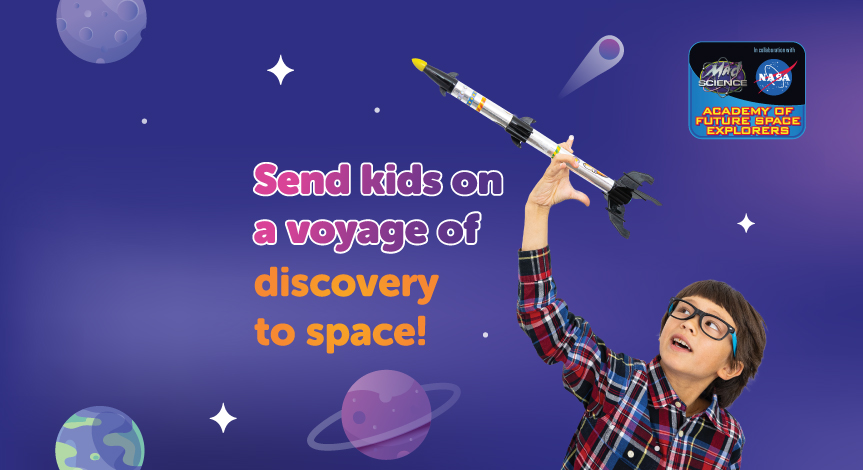 A boy playing with a model rocket from our NASA Academy of Future Space Explorers after-school program.