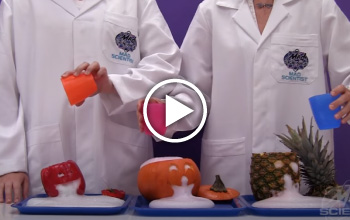 2 mad science instructors creating a spewing jack-o-lantern